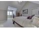 Spacious bedroom featuring a sloped ceiling, large window, and neutral colors, offering a cozy and serene atmosphere at 2861 Shadwell Pl, Greenwood, IN 46143