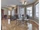 Bright breakfast nook with hardwood floors and windows overlooking the backyard at 2861 Shadwell Pl, Greenwood, IN 46143