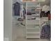 Well-organized closet with built-in shelving and ample hanging space, providing efficient storage solutions at 2861 Shadwell Pl, Greenwood, IN 46143