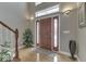 Inviting foyer with a solid wood front door, sidelights, and gleaming hardwood floors at 2861 Shadwell Pl, Greenwood, IN 46143