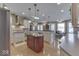 Well-designed kitchen with stainless steel appliances, an island, and breakfast bar seating, open to dining area at 2861 Shadwell Pl, Greenwood, IN 46143