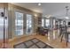 View of open living area with doors to sunroom, dining, and kitchen spaces at 2861 Shadwell Pl, Greenwood, IN 46143