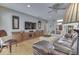 Bright living room features hardwood floors, a ceiling fan, and built-in cabinets at 2861 Shadwell Pl, Greenwood, IN 46143