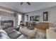 Comfortable living room featuring a fireplace, hardwood floors, and built-in cabinets at 2861 Shadwell Pl, Greenwood, IN 46143