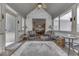 Relaxing sunroom with ample seating, neutral decor, and a seamless transition to the adjacent living spaces at 2861 Shadwell Pl, Greenwood, IN 46143