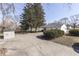Exterior view of home with large backyard, sheds, and mature trees in a park-like setting at 3044 S Keystone Ave, Indianapolis, IN 46237