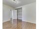Bright bedroom featuring hardwood floors, closet with shelving, and fresh white walls at 3044 S Keystone Ave, Indianapolis, IN 46237
