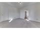This empty bedroom has neutral carpet, light walls, and access to other rooms, making it move-in ready at 3044 S Keystone Ave, Indianapolis, IN 46237