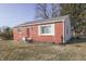 A cozy house showcasing a well-maintained lawn and a mix of brick and siding at 3044 S Keystone Ave, Indianapolis, IN 46237