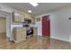 This open kitchen features stainless steel appliances, light tan cabinets, granite countertops, and a skylight at 3044 S Keystone Ave, Indianapolis, IN 46237