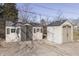 Exterior view of new storage sheds in backyard with gray trim and white siding at 3044 S Keystone Ave, Indianapolis, IN 46237