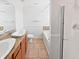 Clean bathroom with dual sinks, a bathtub, tile floors, and decorative accents at 3153 Underwood Dr, Whiteland, IN 46184