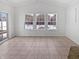Cozy dining area with tile flooring, a sliding glass door, and bright windows at 3153 Underwood Dr, Whiteland, IN 46184