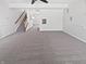 Spacious carpeted living room with white walls and trim, offering a blank canvas with plenty of natural light at 3153 Underwood Dr, Whiteland, IN 46184