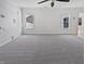 Spacious living room with carpet flooring, crown molding, and large windows at 3153 Underwood Dr, Whiteland, IN 46184