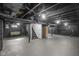 The basement features exposed joists and duct work and a brick column at 3701 N Temple Ave, Indianapolis, IN 46218