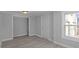 This room has light gray walls, with a window, and a door at 3701 N Temple Ave, Indianapolis, IN 46218