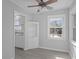 Bright dining area showcases new laminate flooring, neutral paint, and an adjacent modern kitchen at 3701 N Temple Ave, Indianapolis, IN 46218