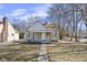 Charming home featuring a covered front porch and stone exterior, perfect for a cozy living experience at 3701 N Temple Ave, Indianapolis, IN 46218