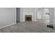 Spacious living room featuring a decorative fireplace, laminate flooring, and neutral paint tones at 3701 N Temple Ave, Indianapolis, IN 46218