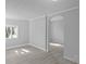 The living room has light gray walls and an arched doorway at 3701 N Temple Ave, Indianapolis, IN 46218