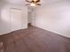 Clean bedroom featuring neutral walls, a closet, carpet flooring, and a ceiling fan at 3743 Celtic Dr, Indianapolis, IN 46235