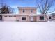 Two-story home featuring an attached garage, and snow-covered front yard at 3743 Celtic Dr, Indianapolis, IN 46235