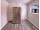 Kitchen area featuring stainless steel refrigerator and hardwood flooring at 3743 Celtic Dr, Indianapolis, IN 46235