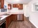 Updated kitchen with stainless steel appliances and wood cabinets at 3743 Celtic Dr, Indianapolis, IN 46235