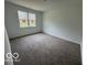 Bedroom featuring a large window, neutral walls, and carpet flooring at 3912 Bamboo Branch Dr, Clayton, IN 46118