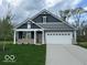 Charming home with a well-manicured lawn, a two-car garage, and stylish gray siding at 3912 Bamboo Branch Dr, Clayton, IN 46118