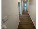 Hallway featuring beautiful hardwood floors and neutral-colored walls that create a clean and modern feel at 3912 Bamboo Branch Dr, Clayton, IN 46118