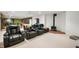 Entertainment basement with reclining seats and a cozy stove at 3949 W 250 N, Anderson, IN 46011