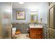 Cozy powder room with blue wallpaper, wood toilet seat, and traditional vanity with drawers and light fixture at 3949 W 250 N, Anderson, IN 46011