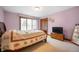 Cozy bedroom with a bed, a dresser, a TV and a window with natural light at 3949 W 250 N, Anderson, IN 46011