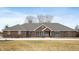Charming brick home featuring a classic design and welcoming curb appeal on a large lot at 3949 W 250 N, Anderson, IN 46011