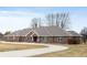 Stunning brick home features a circular driveway and meticulously maintained lawn at 3949 W 250 N, Anderson, IN 46011