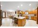 Spacious kitchen with island, bar stool seating, stainless appliances, and sunny breakfast nook at 3949 W 250 N, Anderson, IN 46011