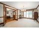 Elegant living room with neutral carpet, and wood trim throughout the space at 3949 W 250 N, Anderson, IN 46011