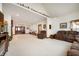 Bright living room offers neutral decor, plush seating, and an open floor plan at 3949 W 250 N, Anderson, IN 46011