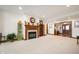 Cozy living room with a fireplace, neutral carpet and view of the front entry at 3949 W 250 N, Anderson, IN 46011
