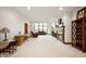 Spacious living room with natural light, cozy fireplace, and an open floor plan at 3949 W 250 N, Anderson, IN 46011