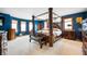 Spacious main bedroom features a four-poster bed, bay window, and plush carpeting at 3949 W 250 N, Anderson, IN 46011
