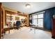 Versatile office with built-in shelving, desk area, and natural light at 3949 W 250 N, Anderson, IN 46011