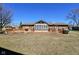 A brick house with a covered deck and a large, fenced backyard at 4109 E Epler Ave, Indianapolis, IN 46237
