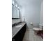 Bathroom featuring a dark granite vanity and tile floor at 4109 E Epler Ave, Indianapolis, IN 46237