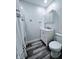 Well-lit bathroom with modern vanity, medicine cabinet, and a shower with curtain at 4109 E Epler Ave, Indianapolis, IN 46237