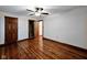 Bedroom with hardwood floors, doors, and a ceiling fan at 4109 E Epler Ave, Indianapolis, IN 46237