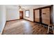 Bedroom with hardwood floors, ceiling fan, and double doors at 4109 E Epler Ave, Indianapolis, IN 46237