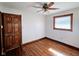 Bright bedroom featuring hardwood flooring, and a window providing natural light at 4109 E Epler Ave, Indianapolis, IN 46237